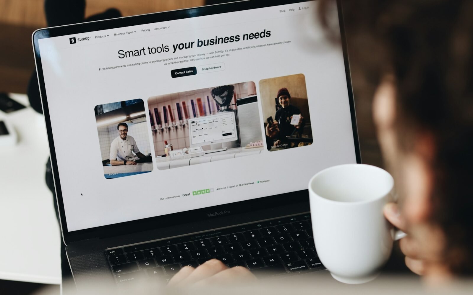 Small business owner managing clients on a laptop
